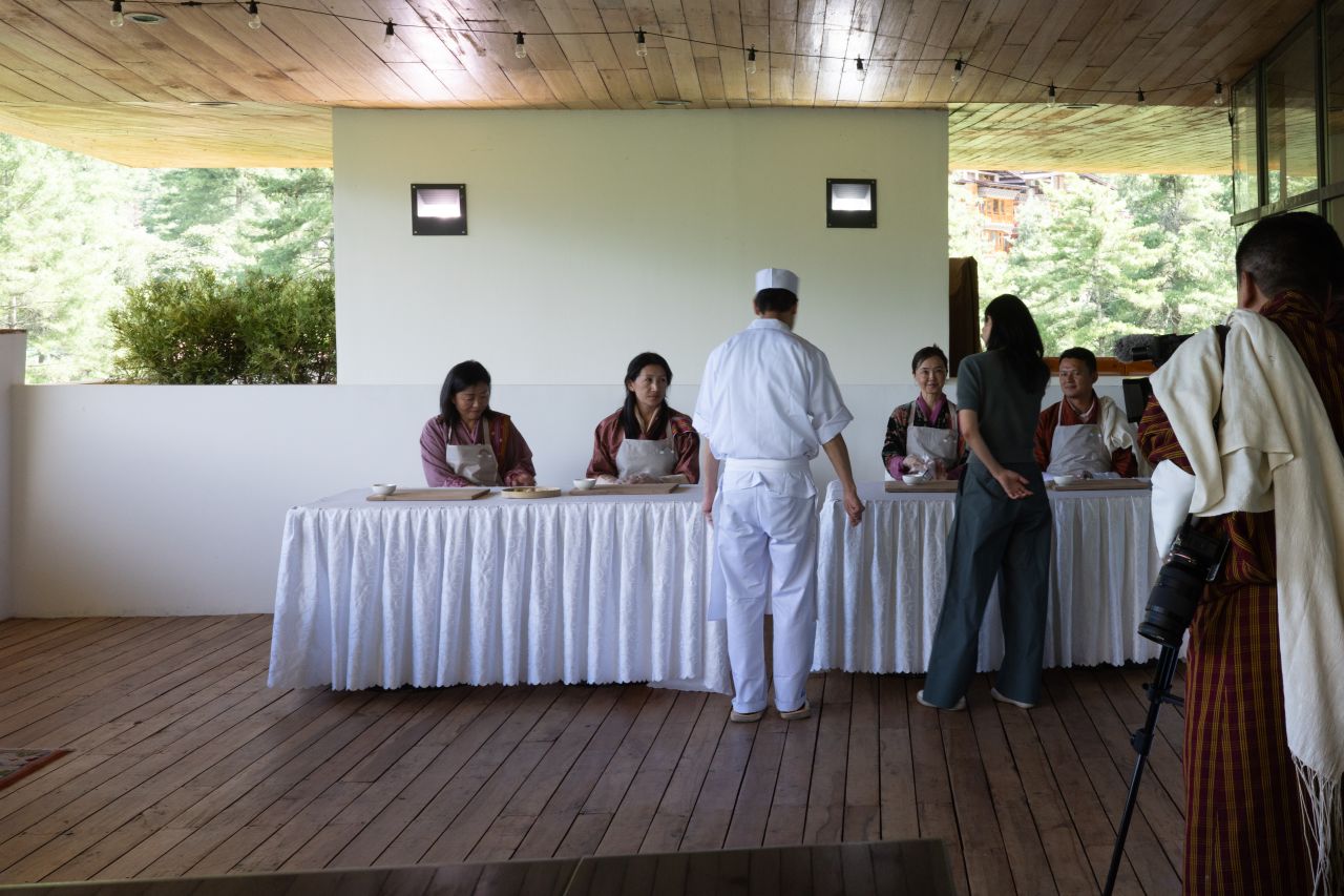 The Selwa team at worktables with a Wakuden chef during the wagashi workshop in Thimphu