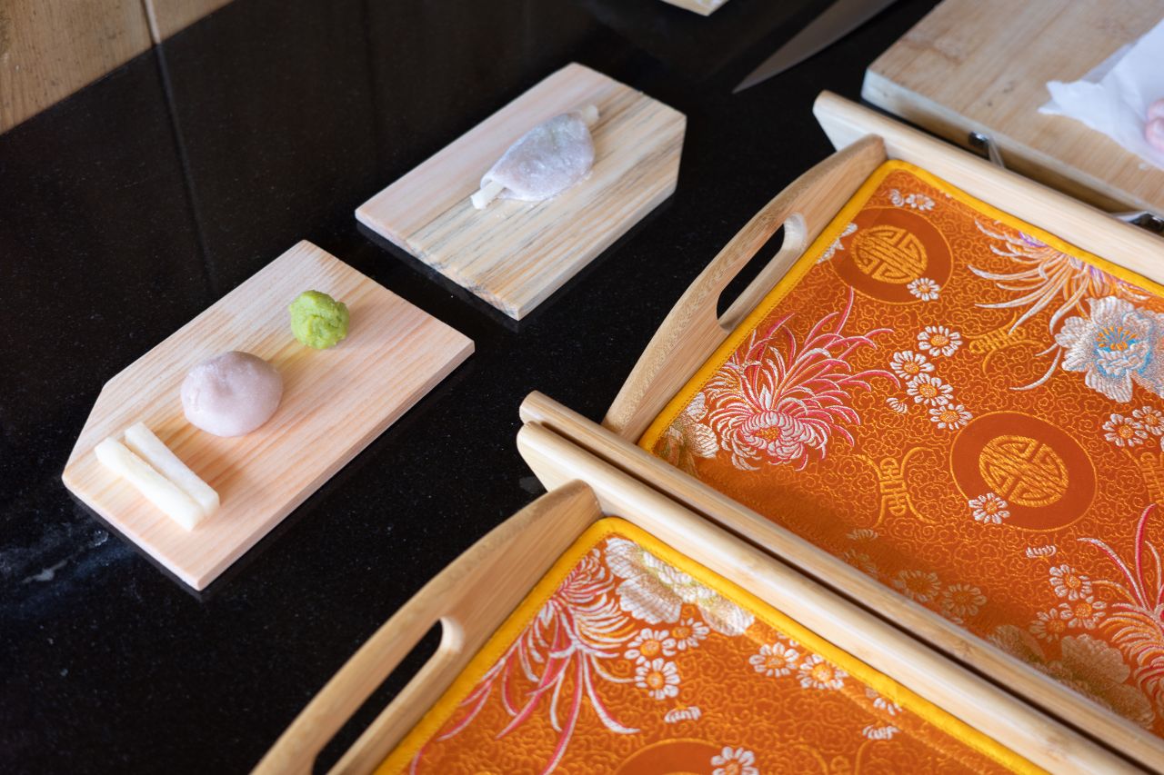 Freshly made wagashi sweets on cedar boards